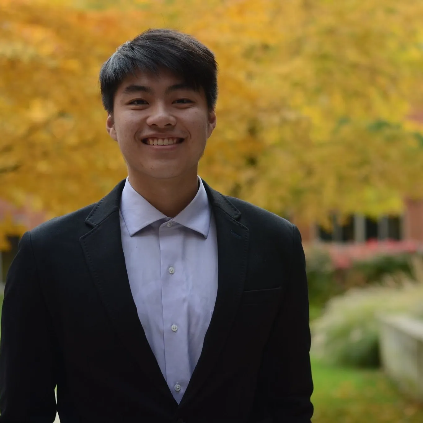 Derron Yu smiling outdoors